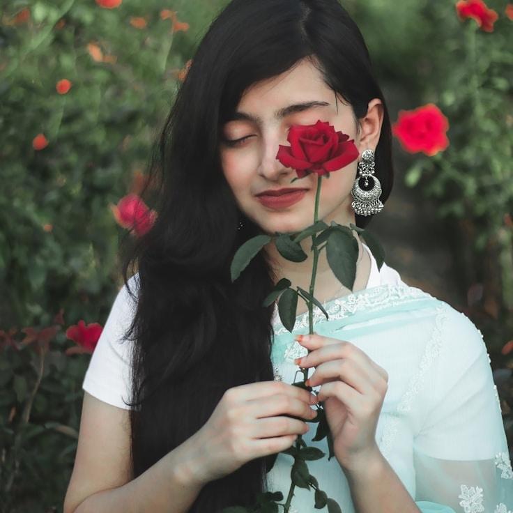 Aanya Kapoor, Lead Design Curator at SiloOrchardField, reviewing corporate floral arrangements